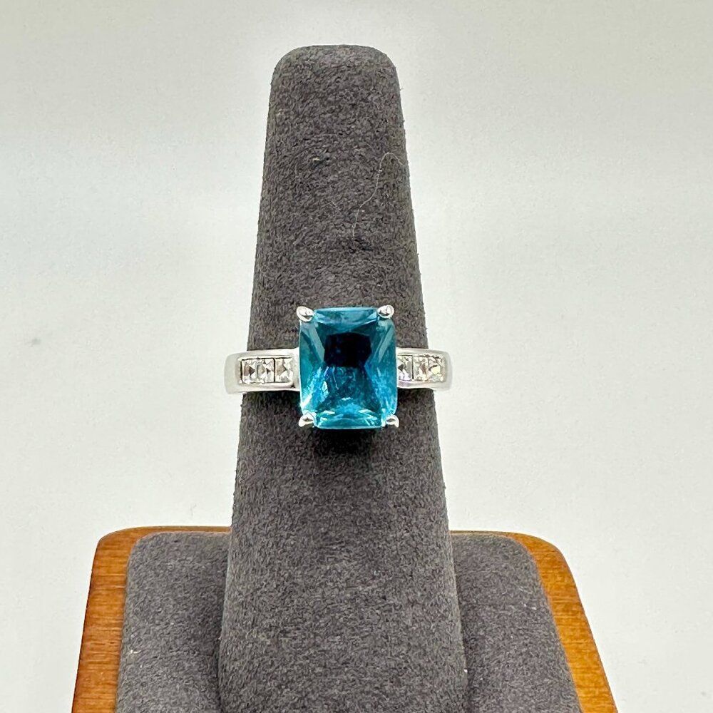 Ring with Aquamarine Blue Colored Center Stone